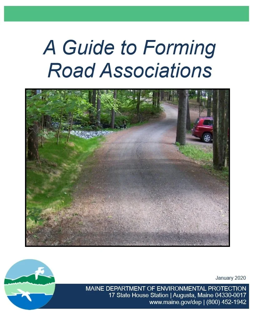 Cover page of a guide titled 'A Guide to Forming Road Associations' with a photograph of a gravel road winding through a wooded area, and a red vehicle parked on the right side.