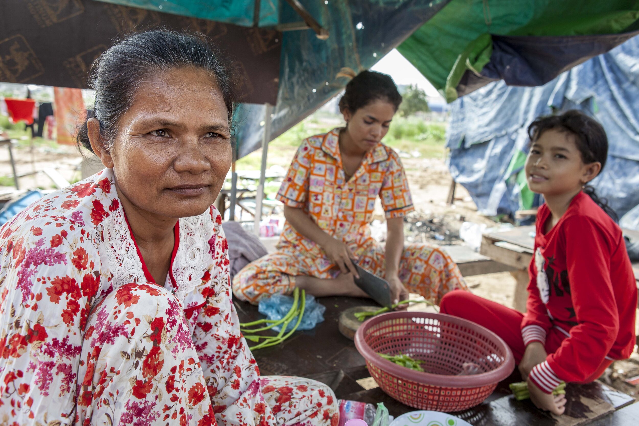  53 year old construction worker Em Seng sits with other women who have moved with their families from Prey Veng province to work in construction. 