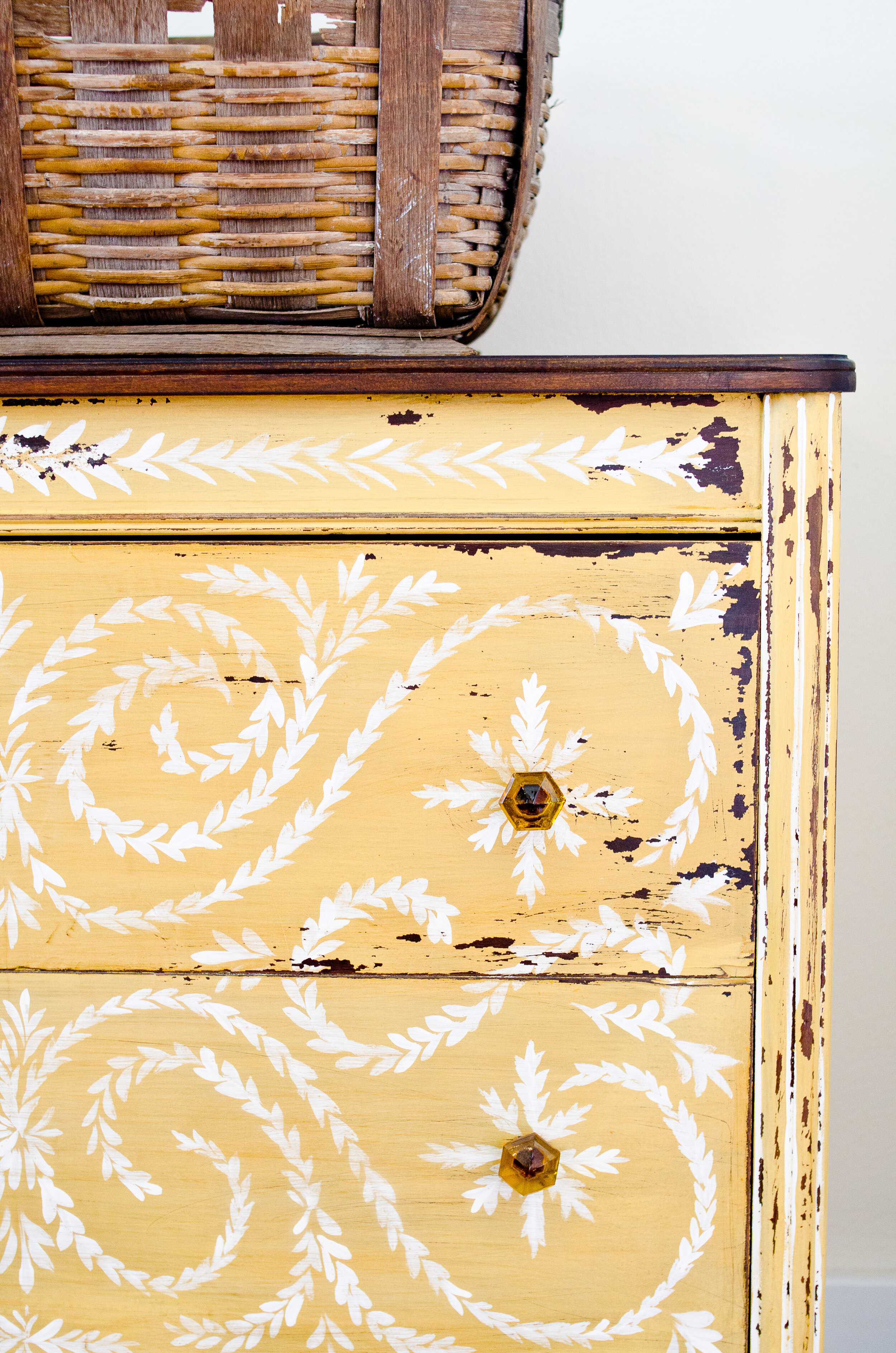 Chippy antique dresser painted in Mustard Seed Yellow Milk Paint with hand-painted floral design