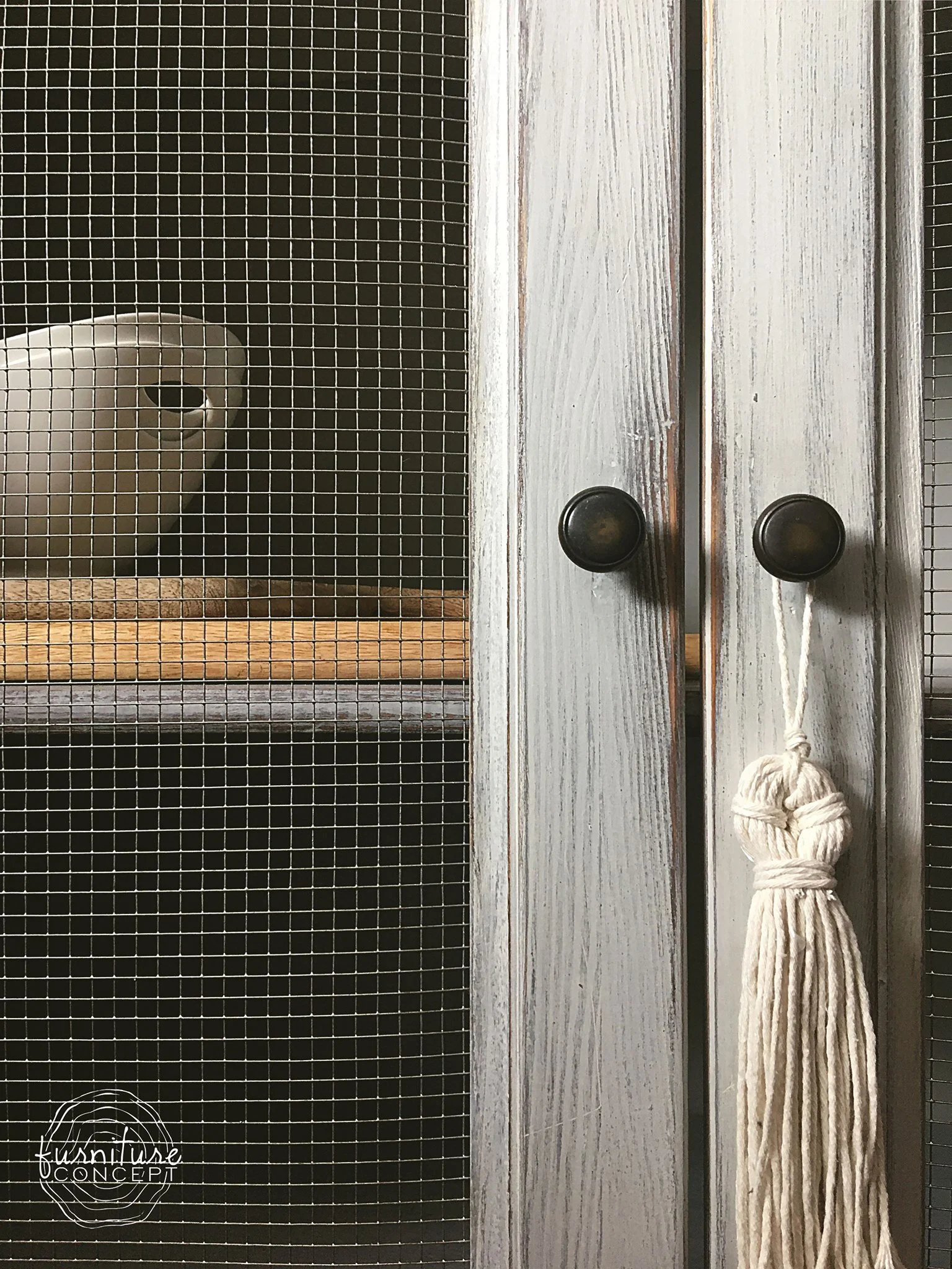 Ikea cupboard painted in Miss Mustard Seed’s Marzipan topped with White Wax with wire mesh on doors