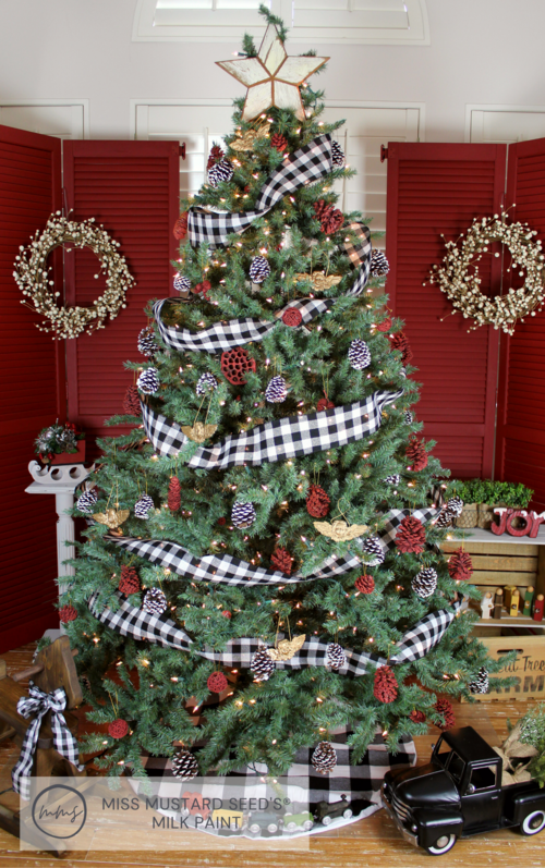 Christmas tree in front of shutters painted in Schoolhouse Red Milk Paint