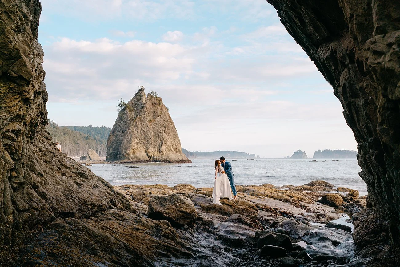 Couple eloping at hole-in-the-wall, Rialto beach Olympic National Park