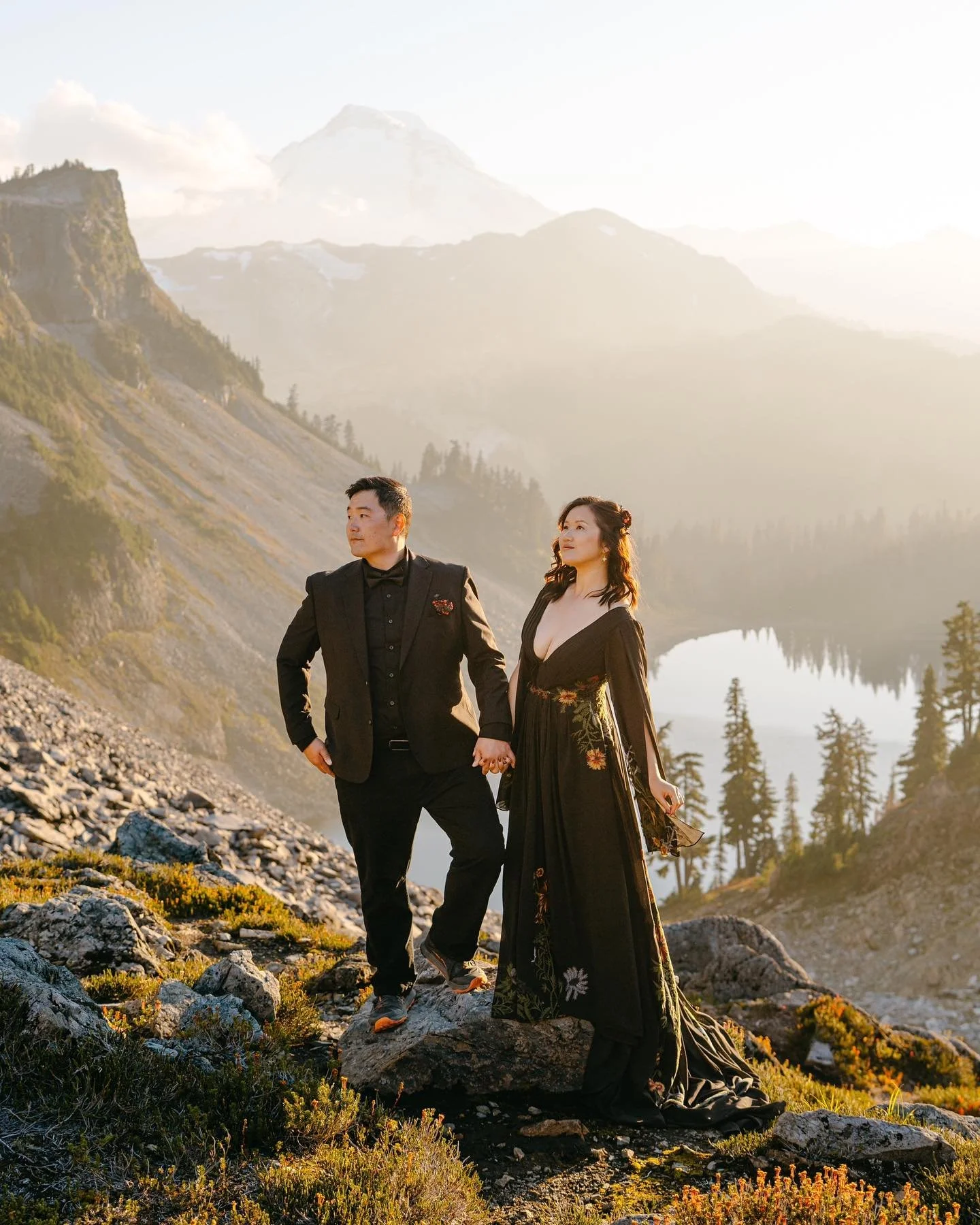 V &amp; E celebrated their love with a two-day Mount Baker elopement that was nothing short of incredible.
On day one, they hiked 2.5 miles through the alpine, exchanged vows surrounded by wild peaks, headed to a stunning lake for a picnic, and&mdash