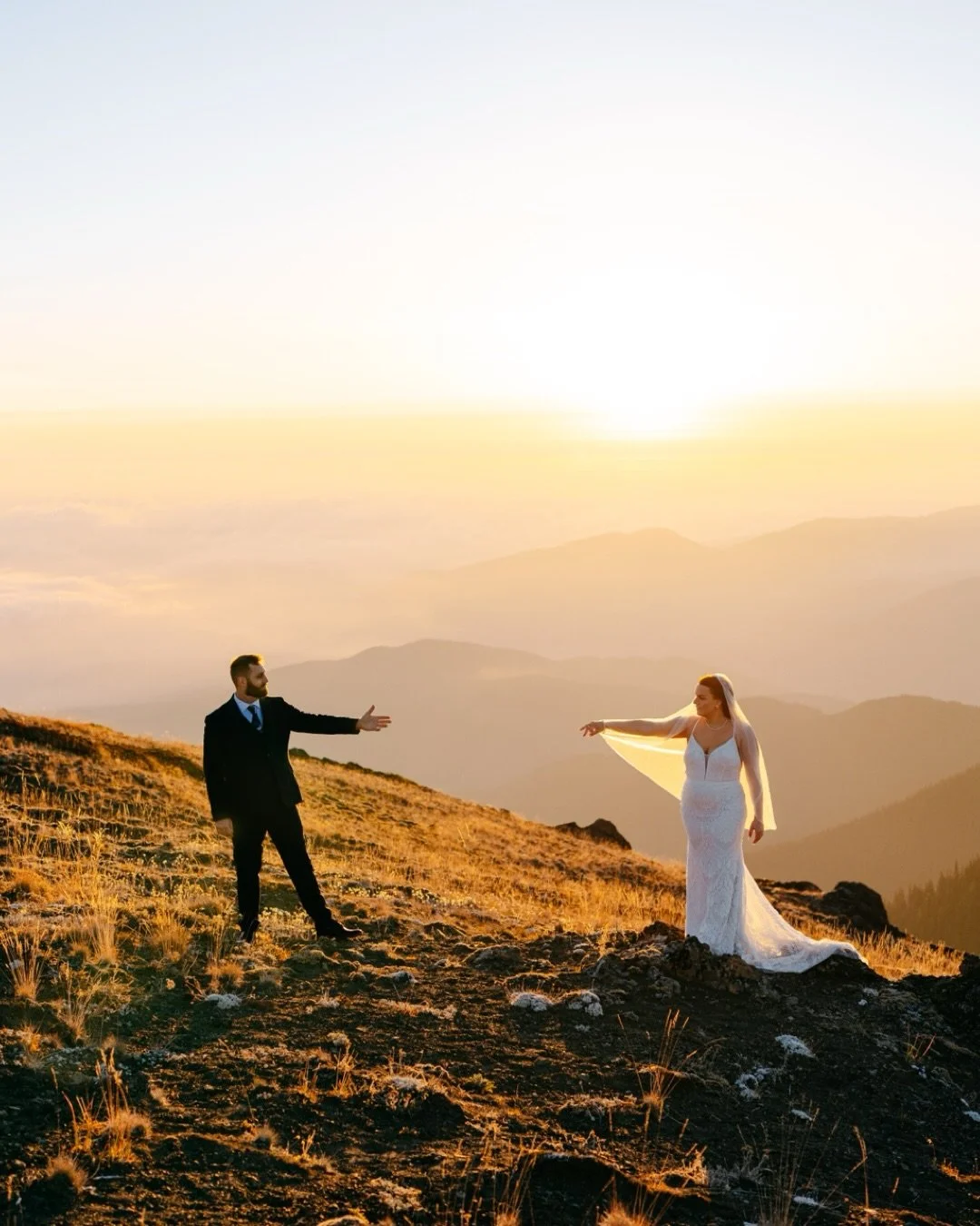 Some days feel like two love stories woven into one &mdash; and Tess &amp; Will wrote theirs beneath sunrise skies and ocean air.  
At dawn, we climbed to the mountaintops for a private first look, the world still quiet, the sun slowly painting the d