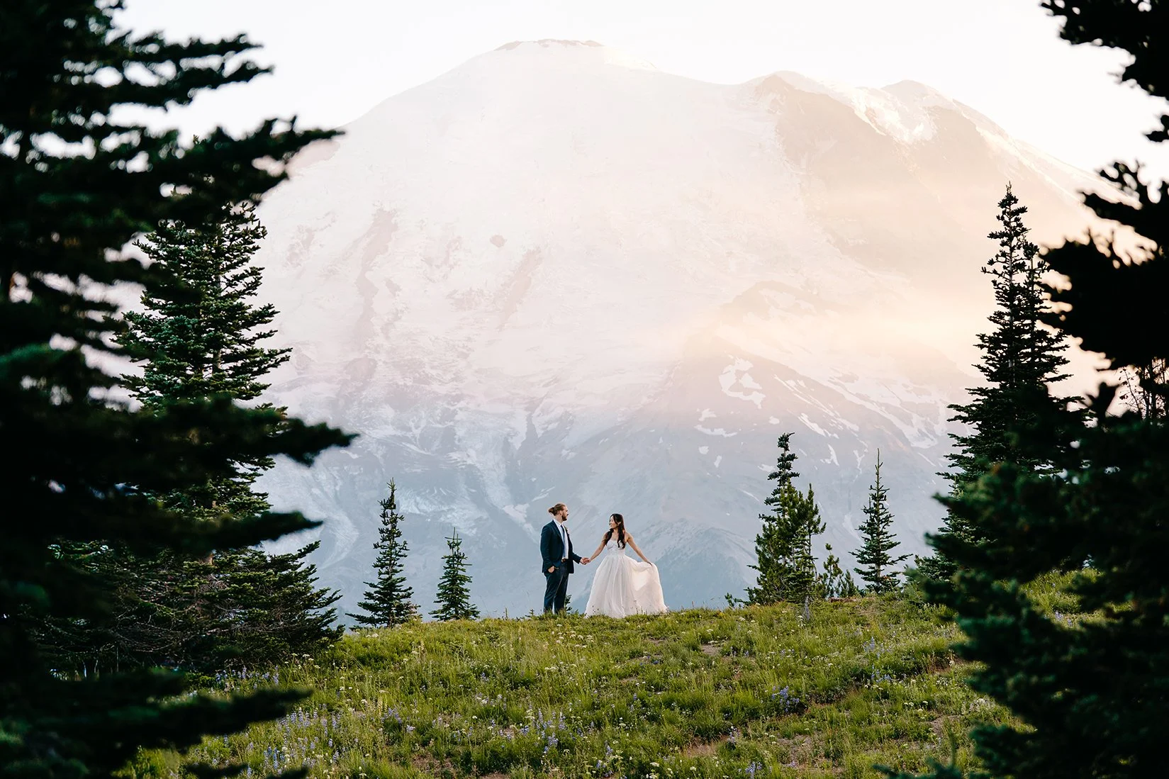 beautiful couple getting married in front of mount rainier