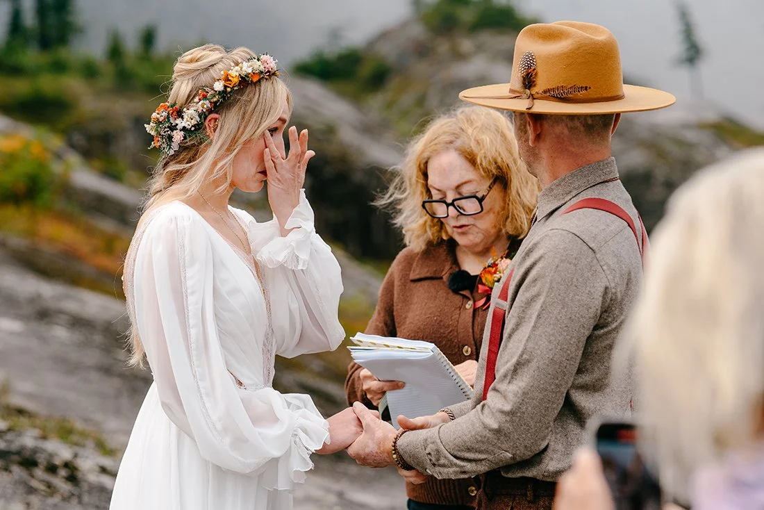 bride crying during emotional elopement ceremony