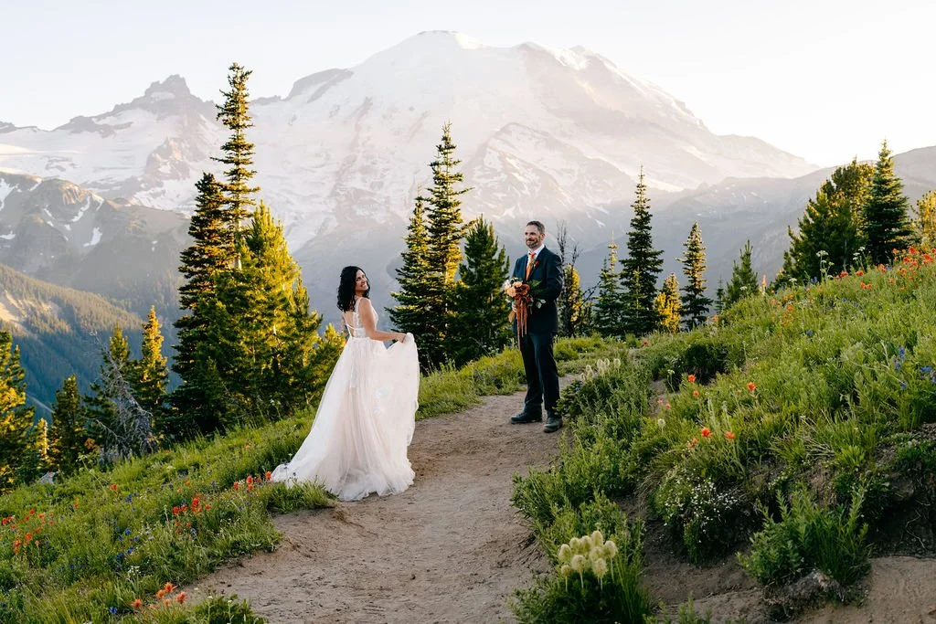 couple eloping in mount rainier during wildflower season