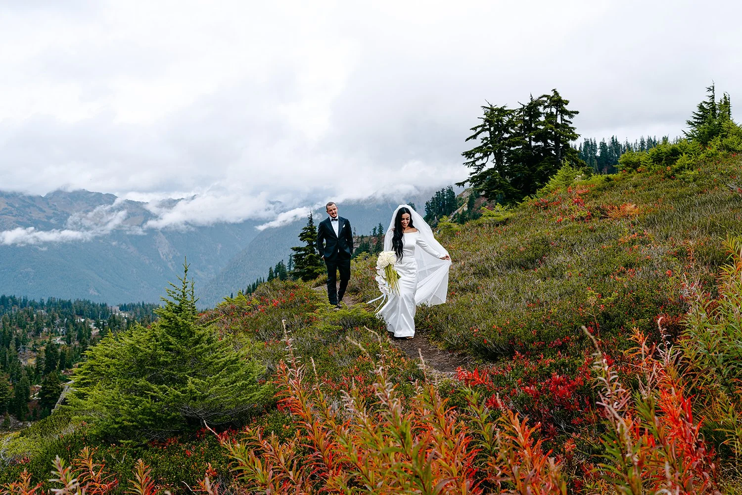 couple walking among fall colors at artist point