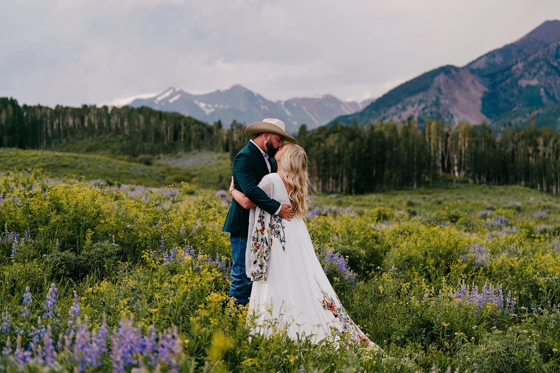 couple getting married among wildflowers in Crested Butte Colorado