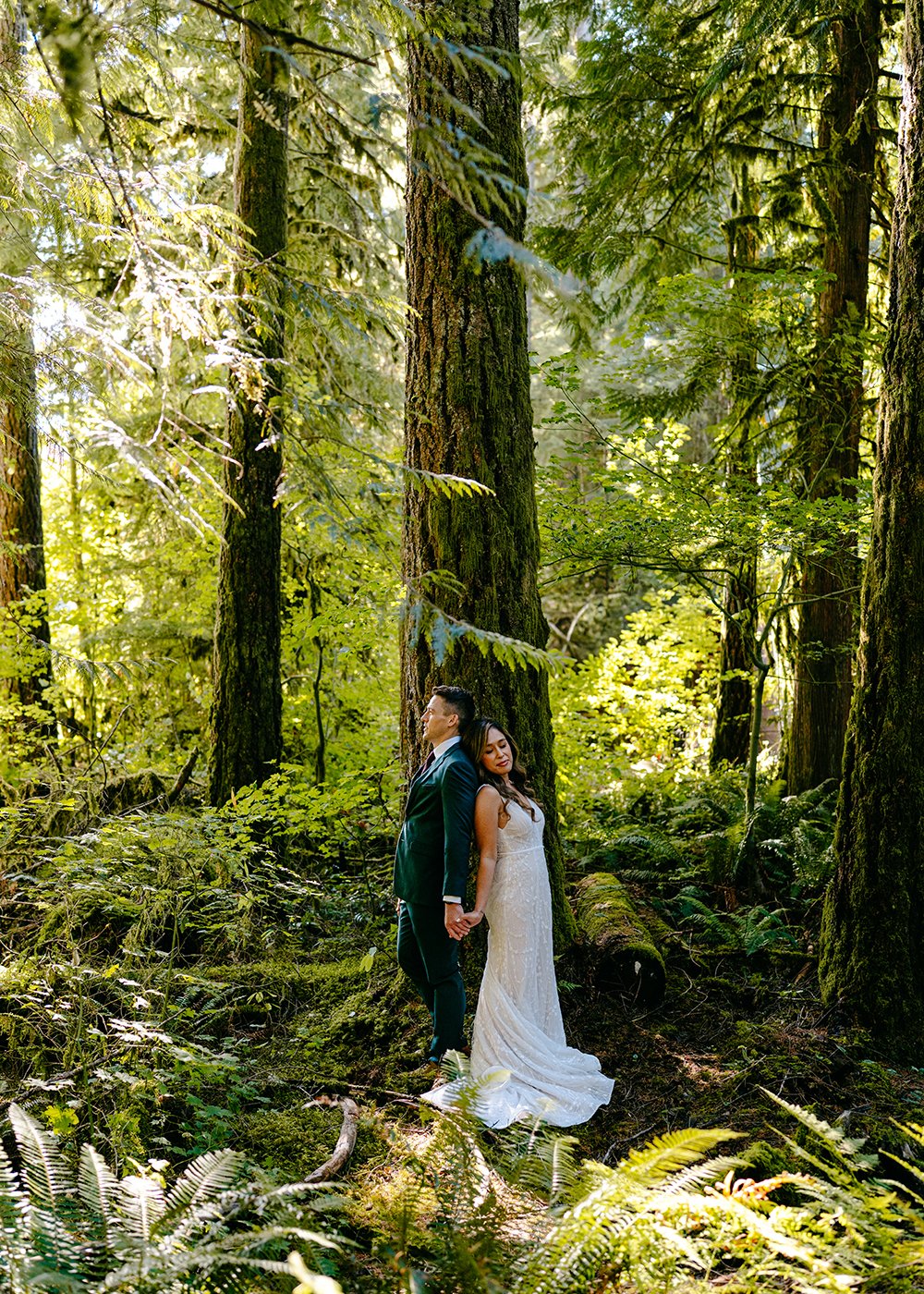 first touch in the forest during wedding near artist point