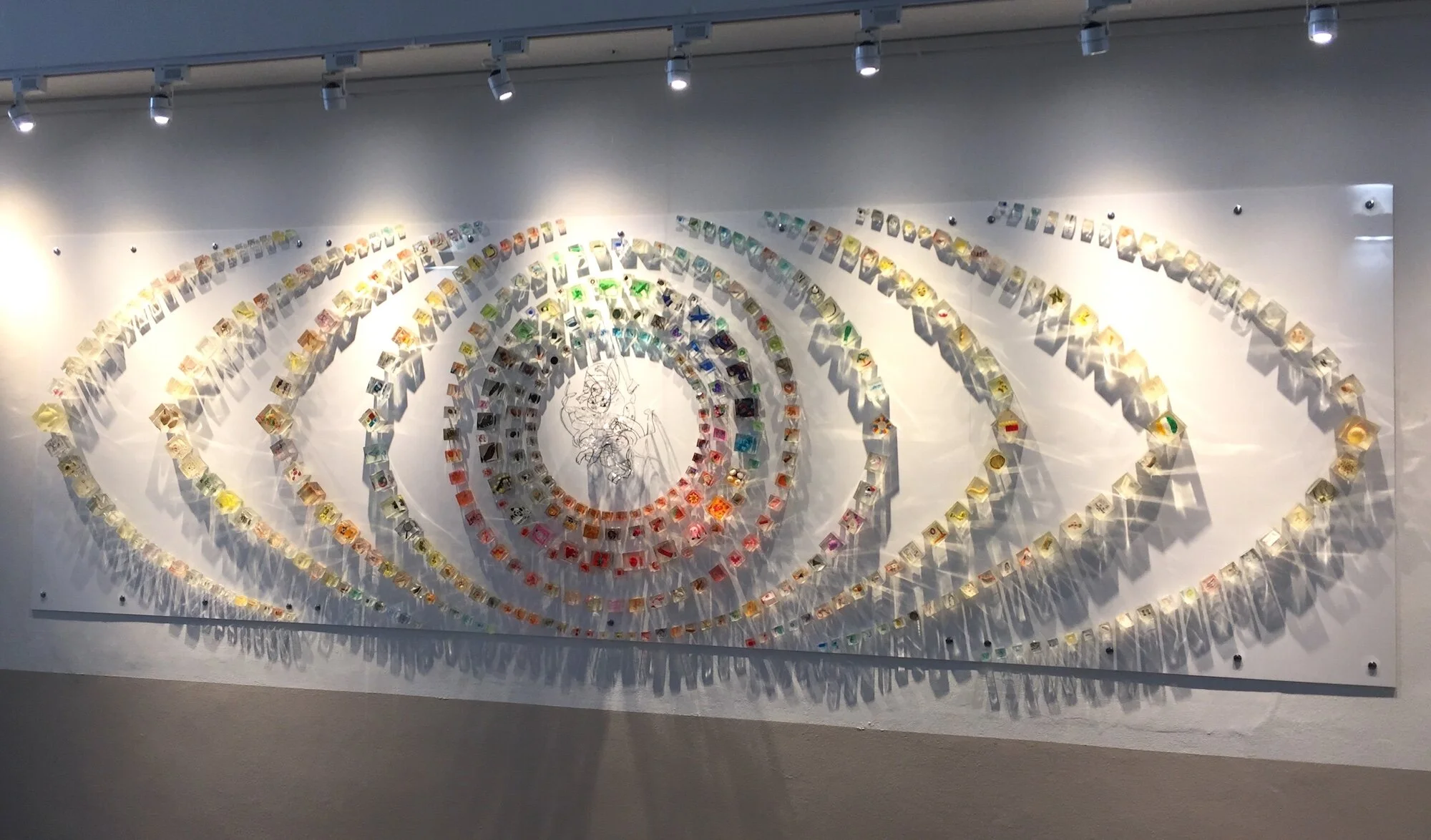 A 4-metre wide, site-specific installation consisting of 500 resin cubes that encapsulate a number of objects brought in by the children of Tanglin Trust Infant School. Completed in September 2021.