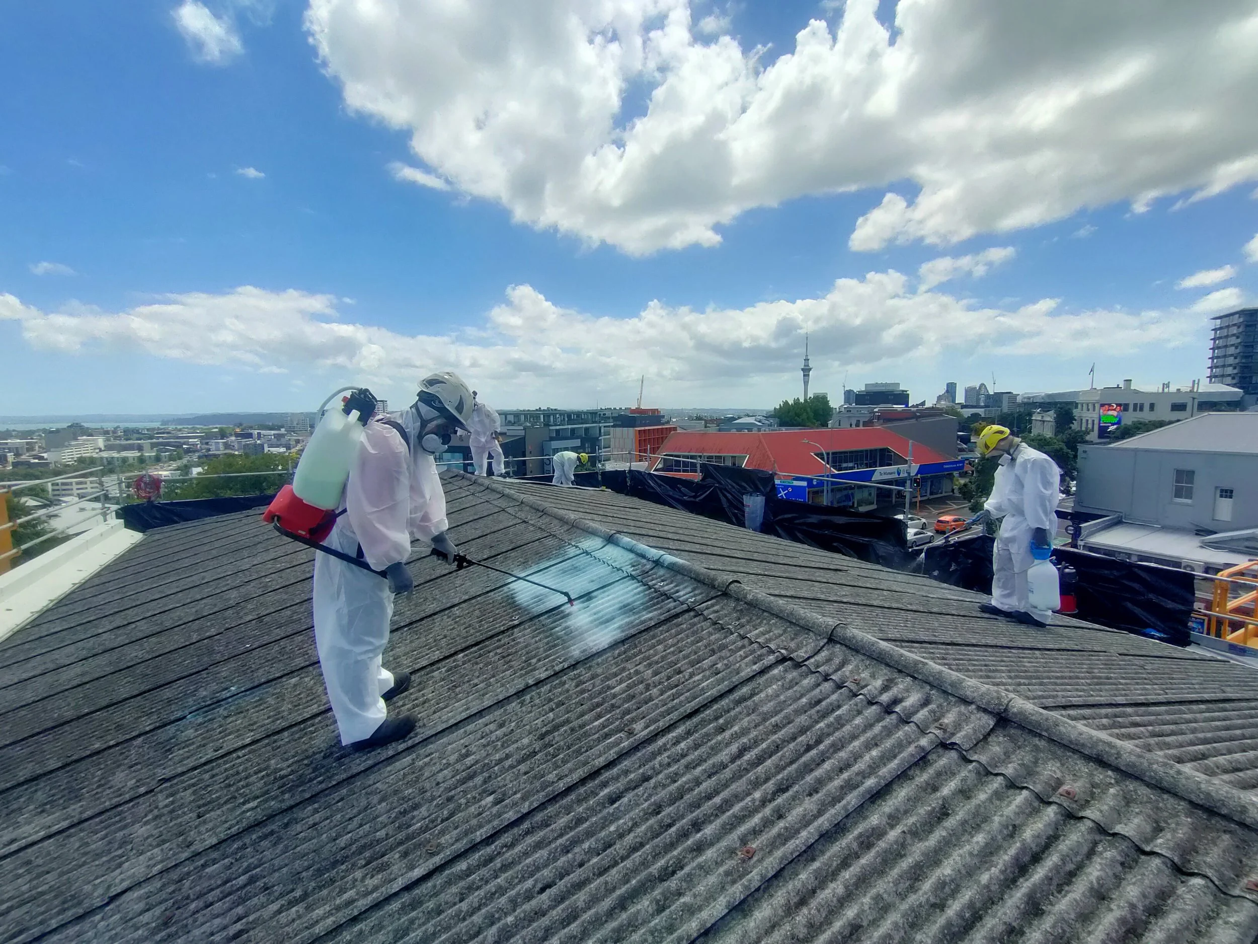 Encapsulating super 6 asbestos roofing on a commercial building before removing asbestos roofing in Auckland