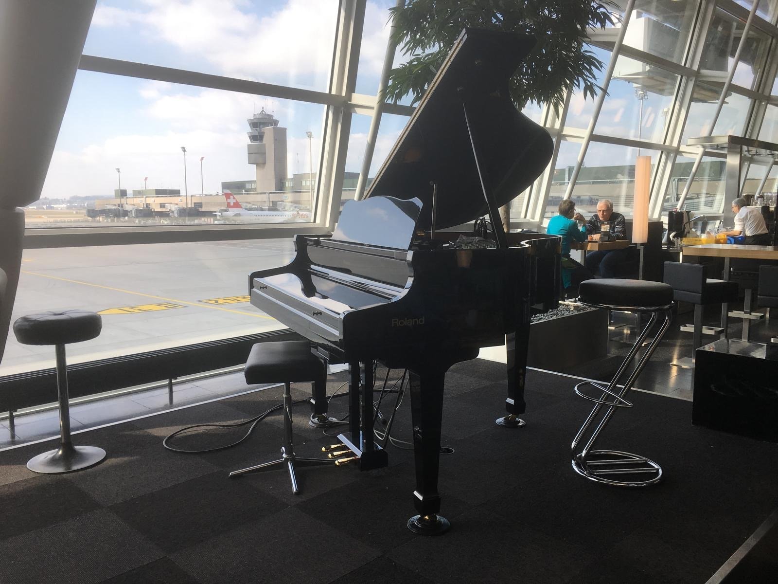 grand piano set up in front of big window