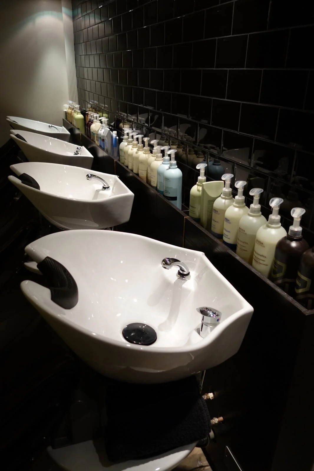 sinks and products lineup at putney salon