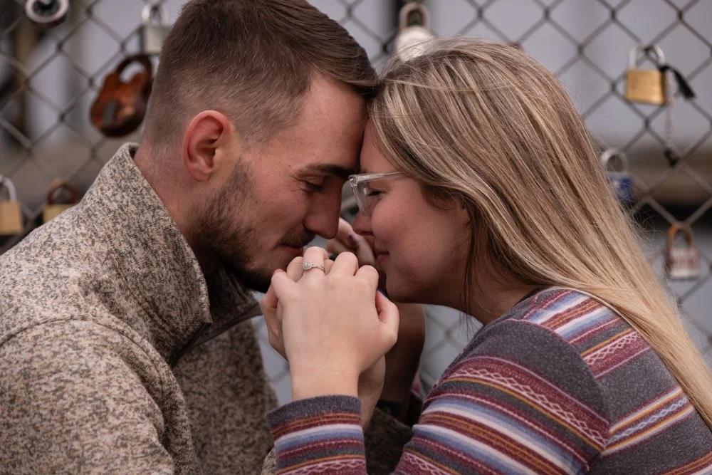 Engaged couple touching foreheads