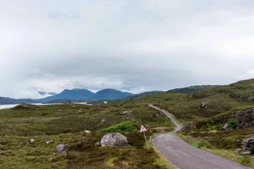 A road winding through the Scottish Highlands
