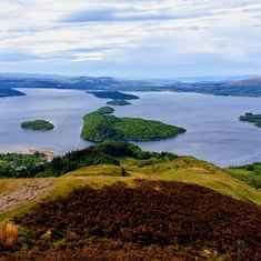 Visit Loch Lomond for scenic views in Loch Lomond and the Trossachs National Park in the Highlands of Scotland during a group, day tour starting in Glasgow with Tour Operator, Scotland's Wild