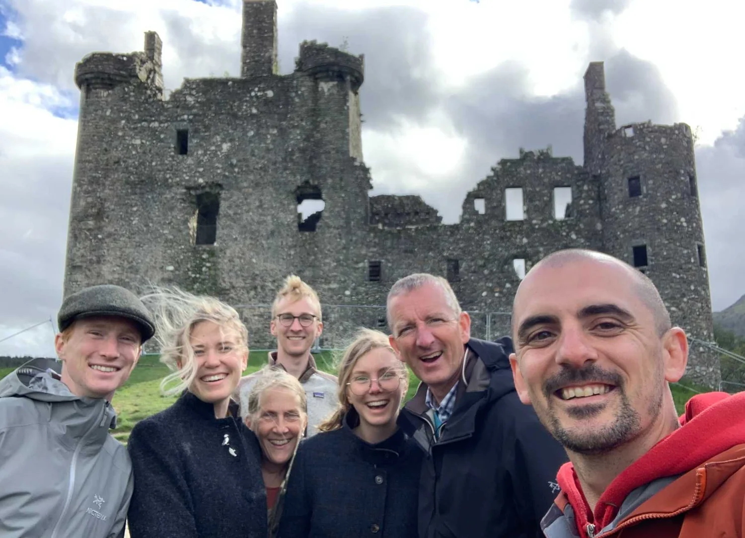Travellers visiting Kilchurn Castle in the Scottish Highlands