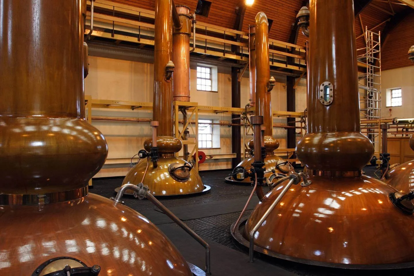 Copper stills inside a Scotch whisky distillery