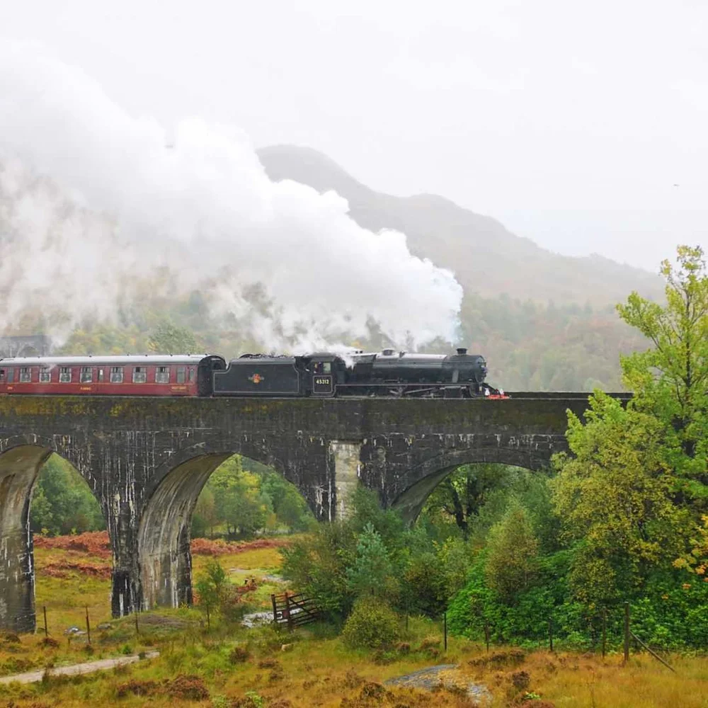 A steam locomotive crossing the Glenfinnan Viaduct