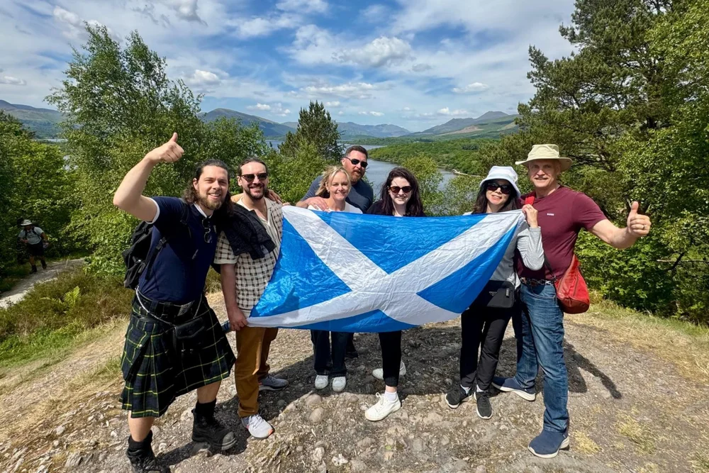 Scotland’s Wild guide Pete with a small tour group overlooking Loch Lomond
