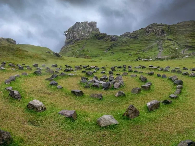 Castle Ewen and the green hills of the Fairy Glen