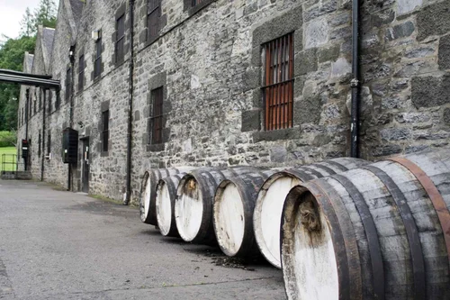 Whisky barrels stacked at an old Highland distillery