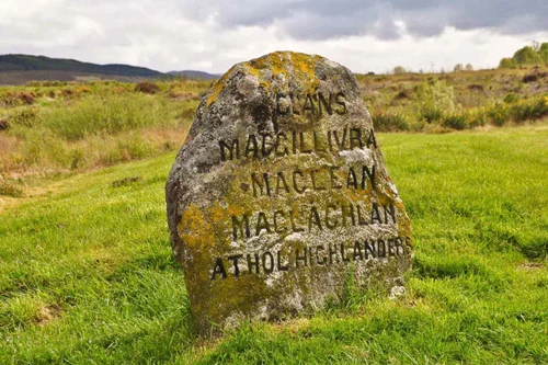 A clan grave stone on Culloden Battlefield, carved with the names of the clans who fell