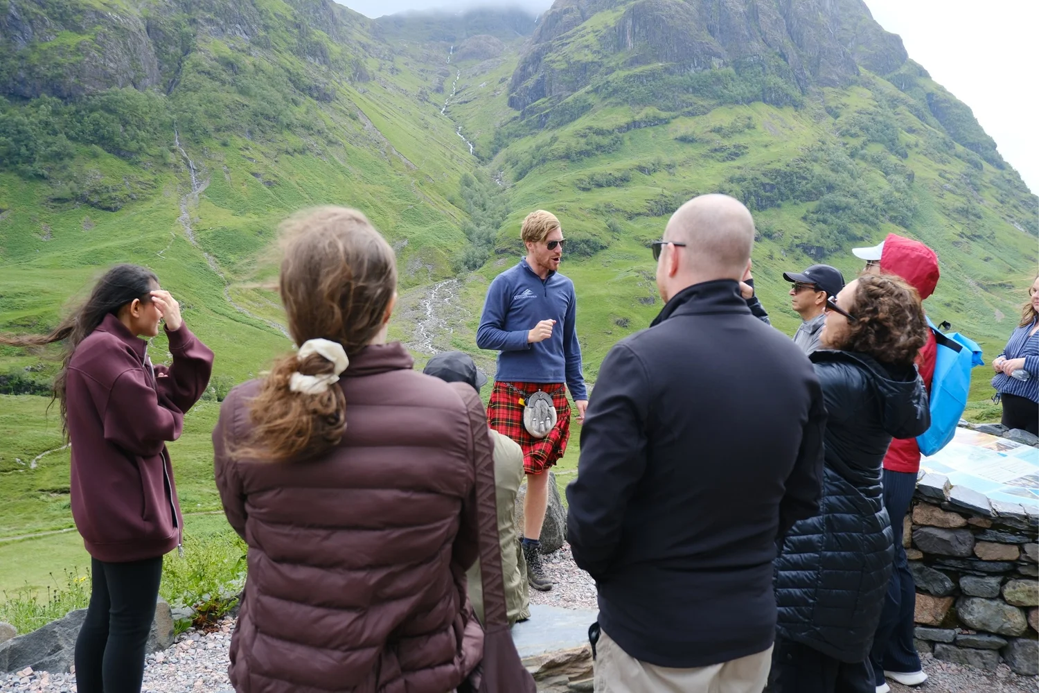 Scotland’s Wild guide Derek sharing Glencoe’s stories with guests outdoors