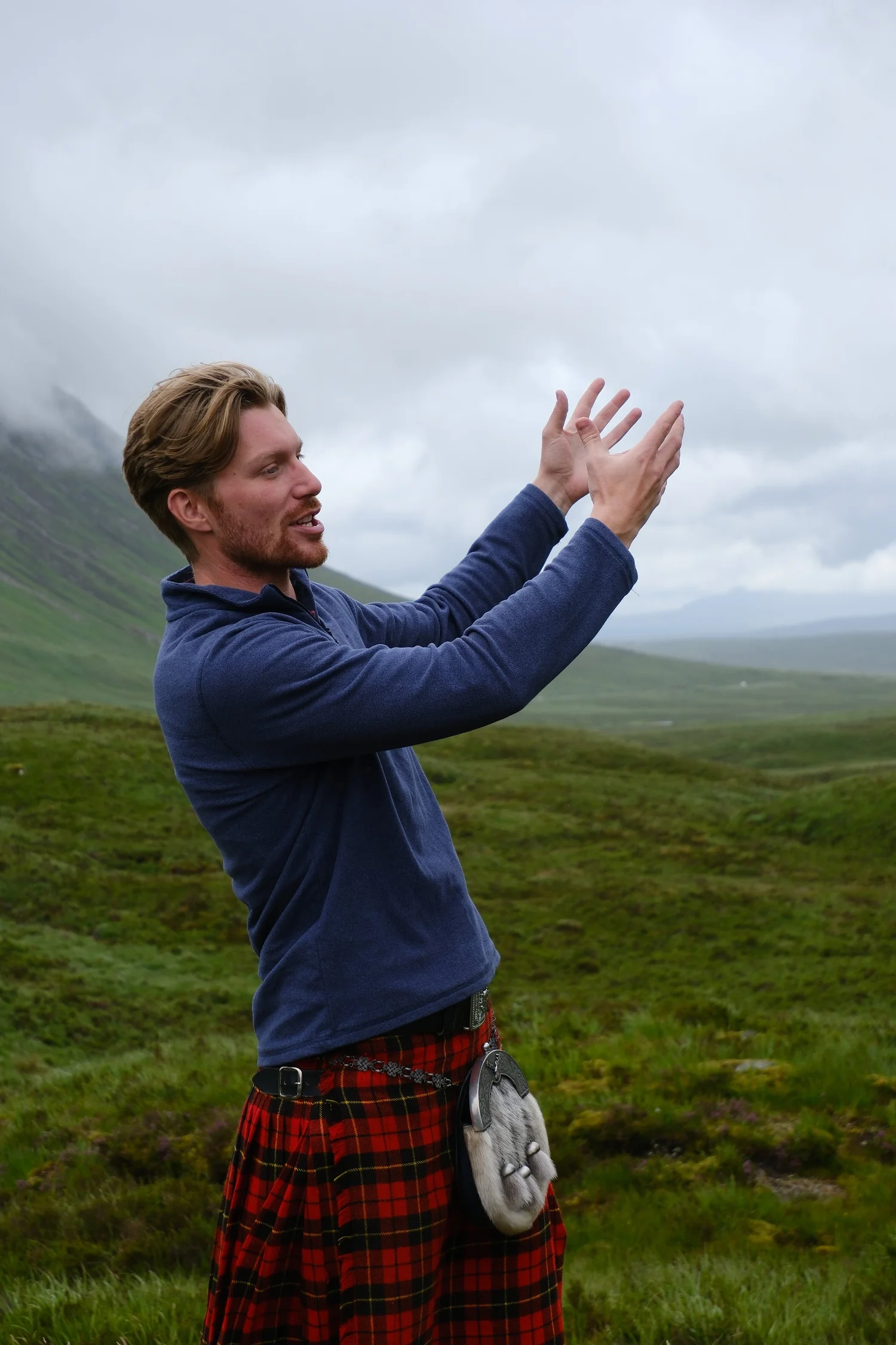 Scotland's Wild guide Derek in a kilt telling a story in the Highlands on the way to Skye