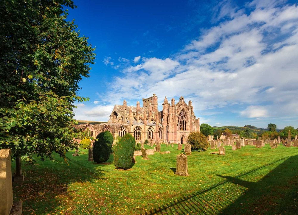 The ruins of Melrose Abbey in the Scottish Borders on a sunny day