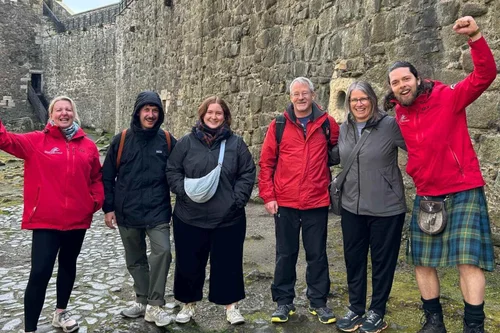 A Scotland's Wild guide and tour group at Blackness Castle, Outlander’s Fort William