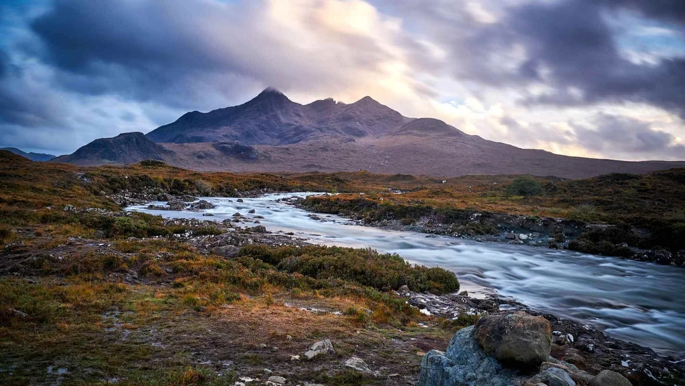 The Cuillin mountains above a river on the Isle of Skye