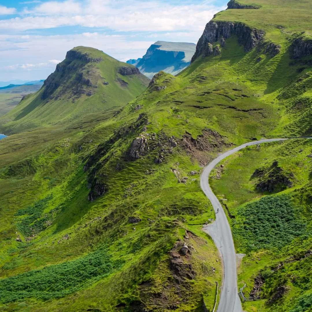 A road winding through the green cliffs of the Quiraing on the Isle of Skye