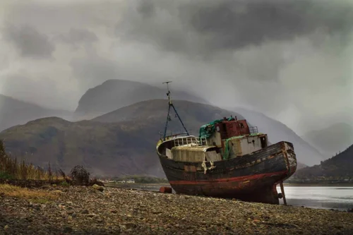An old boat on the shore near Fort William