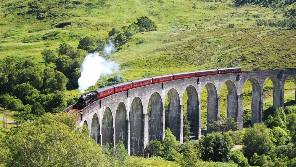 The Jacobite steam train crossing the Glenfinnan Viaduct, on the day tour from Inverness