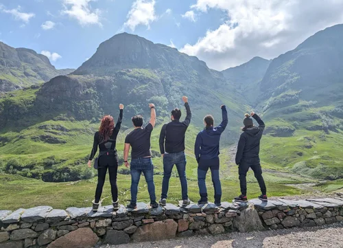 Group of travellers in front of the Glencoe mountains on a private tour