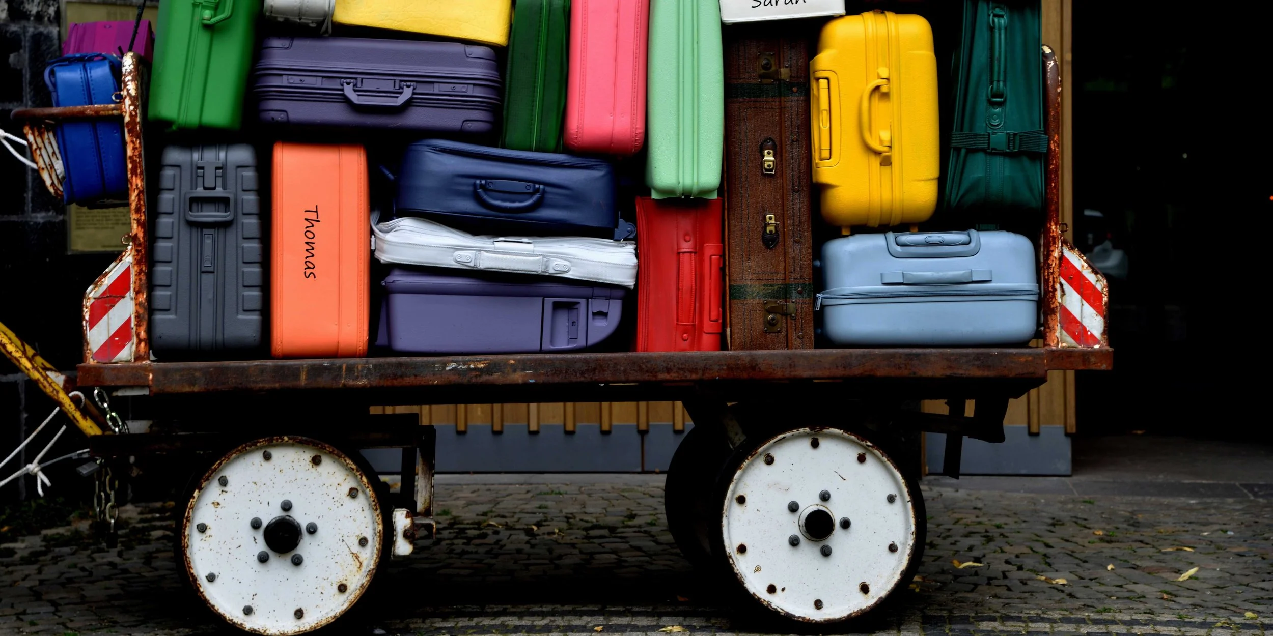 Traveller preparing luggage for a journey around Scotland