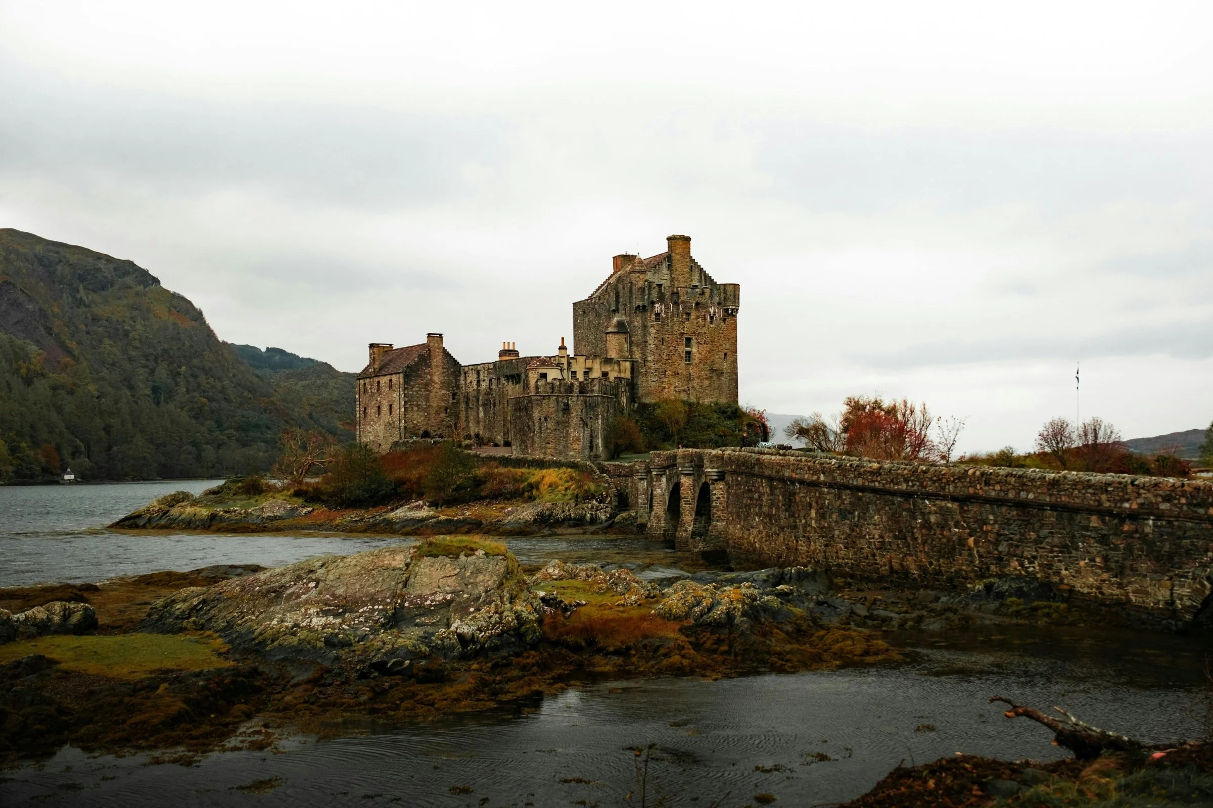 Eilean Donan Castle surrounded by sea lochs and autumn Highland scenery