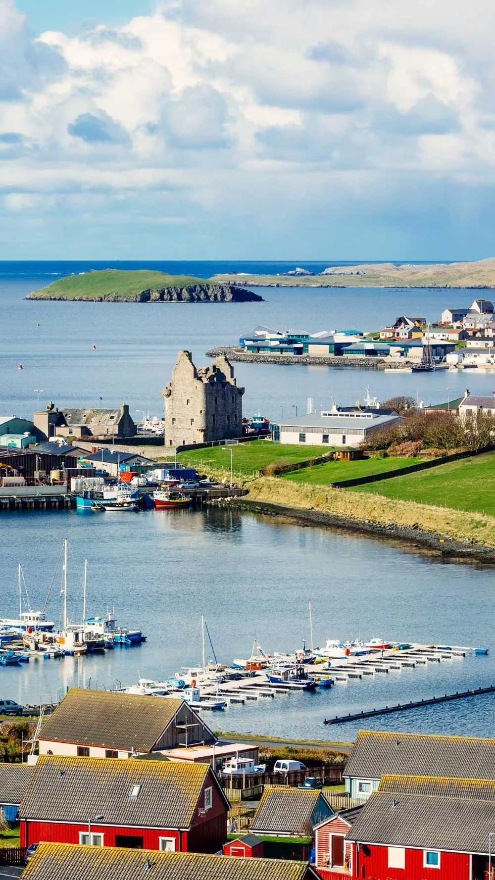 Scalloway harbour with the ruins of Scalloway Castle and fishing boats