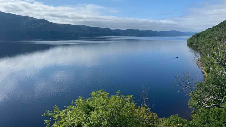 Loch Ness stretching between wooded hills