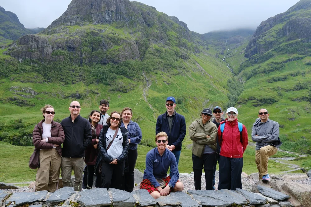 Scotland's Wild guide Derek with a small tour group in Glencoe on the journey towards Skye