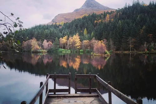 A still loch reflecting the mountains near Glencoe