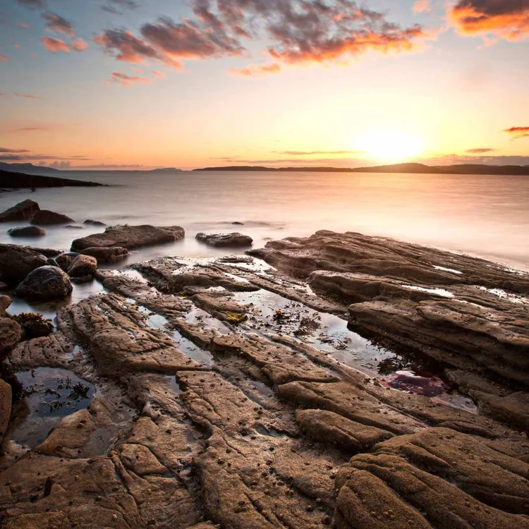 Rocky shoreline on the Isle of Skye at sunset