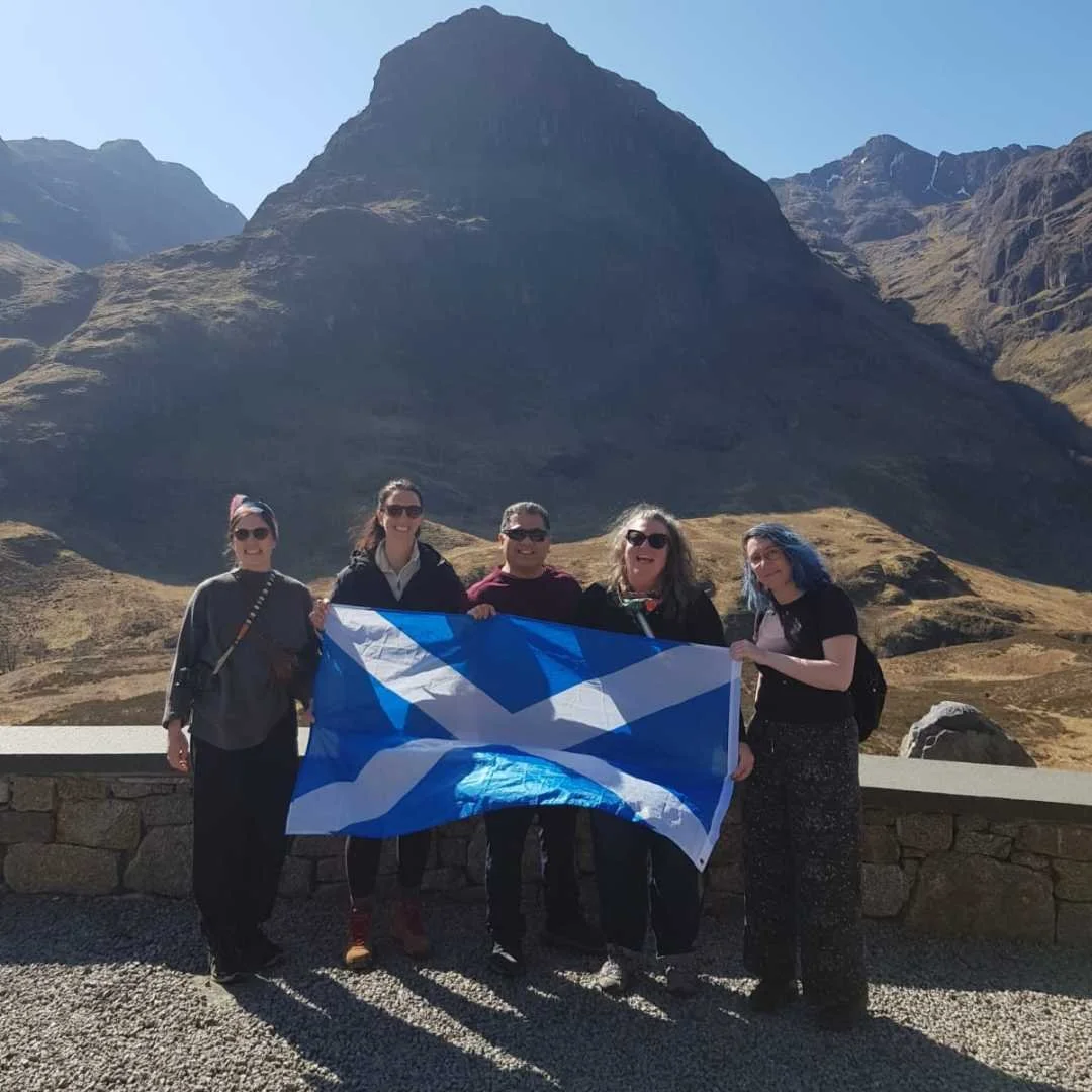Travellers exploring the mountains of Glencoe in Scotland