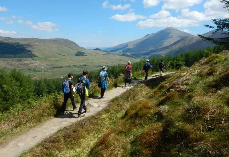 Walking through a dramatic Scottish Highland landscape