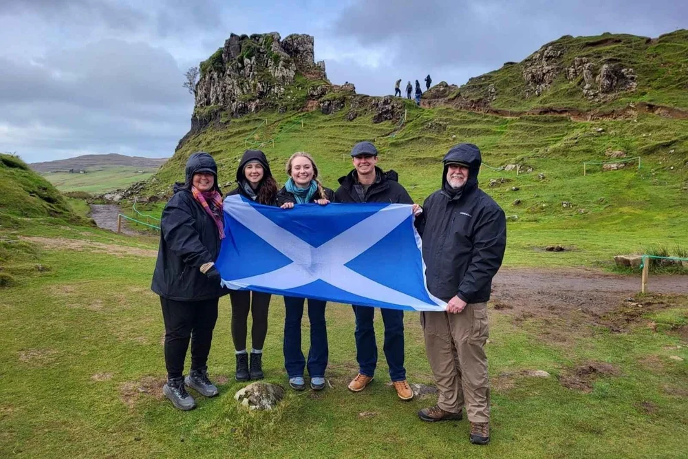 A small group with a Saltire in the Fairy Glen on the Isle of Skye