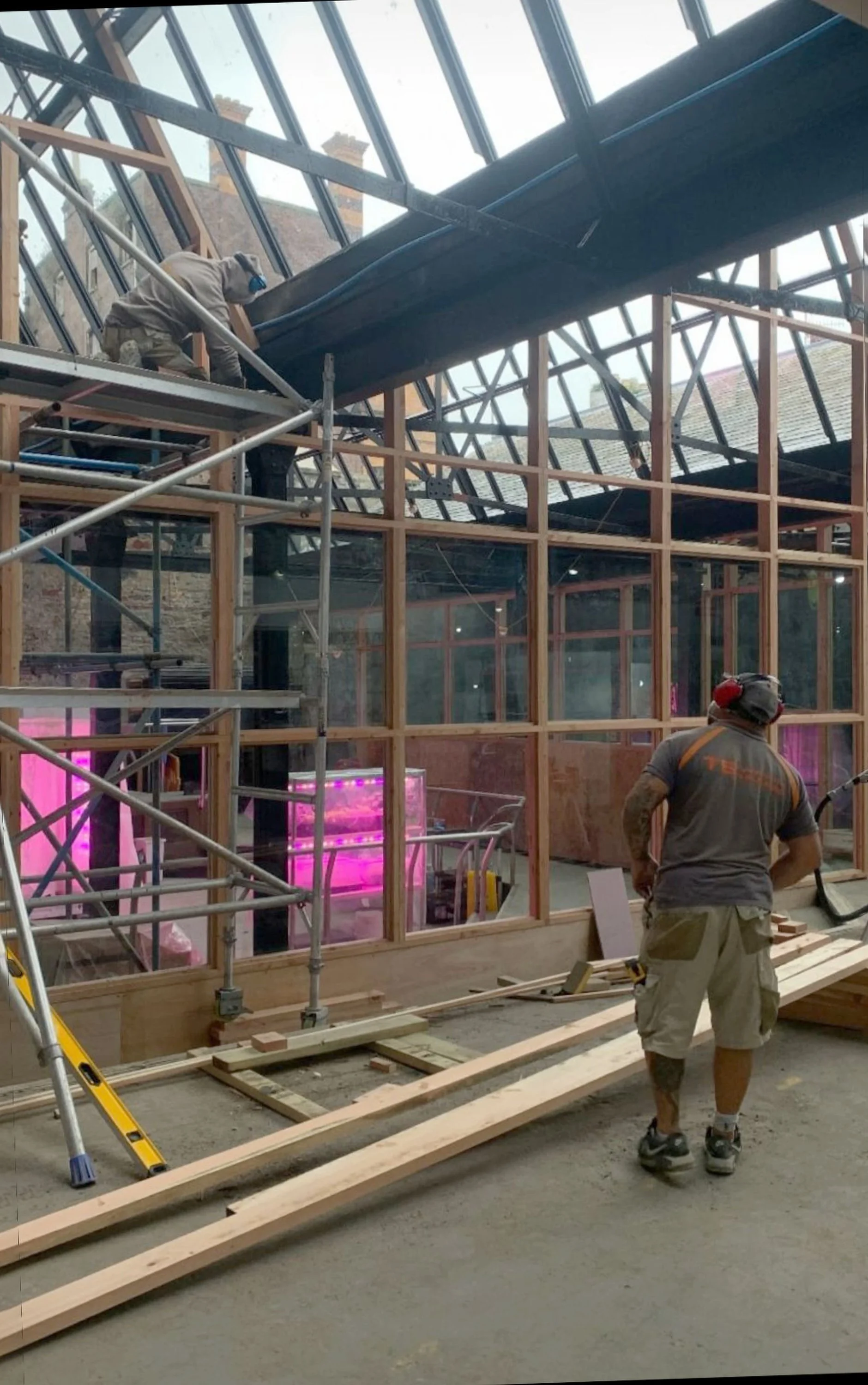 Construction of the glazed wall using local larch and reclaimed glass