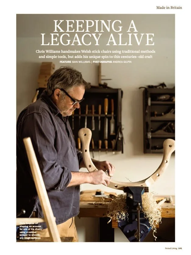 Chairmaker hand-carving a wooden chair in his workshop