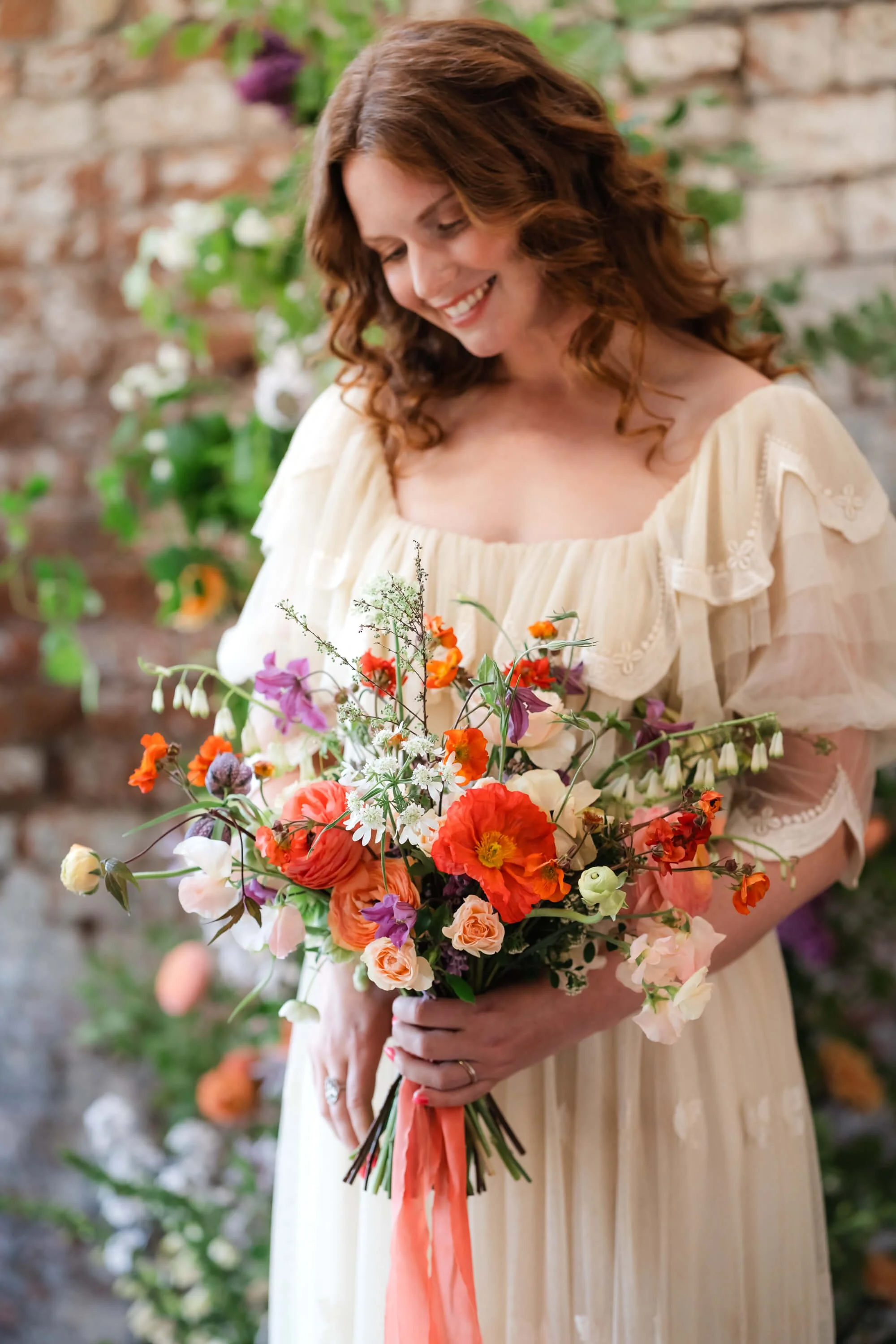 bride-holding-flowers-looking-down.jpg